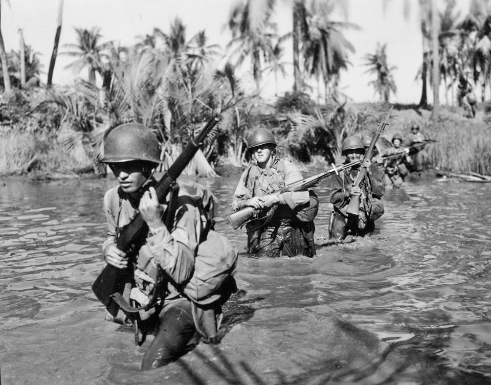 Soldiers with the 43rd Infantry are shown in this photo from the Pacific Theater during World War II. Image courtesy of the 43rd Infantry Division on Facebook.